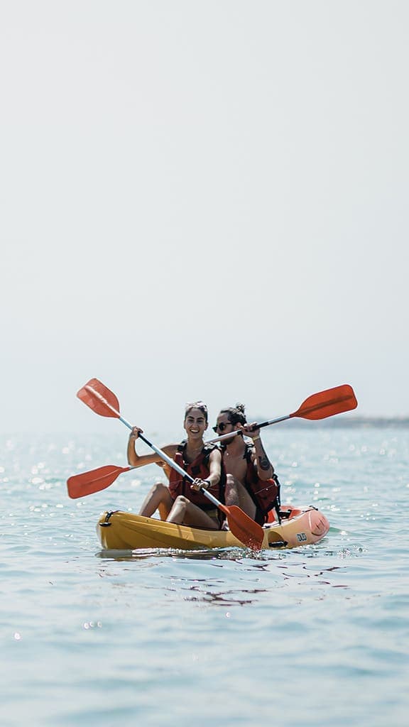 Kayaker paddling along the Vilanova i la Geltrú coast during a half-day rental journey.